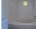 White bathtub with window at 70 Graystone Dr, Covington, GA 30014
