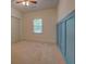Bright bedroom with light blue accent wall at 70 Graystone Dr, Covington, GA 30014