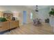 Bright dining room with hardwood floors, a modern light fixture, and a decorative storage cabinet at 70 Graystone Dr, Covington, GA 30014