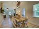Comfortable dining room featuring hardwood floors, a dining room set, and a view into the living room at 70 Graystone Dr, Covington, GA 30014