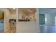 Charming kitchen area with white cabinets, bar seating and views to the living area at 70 Graystone Dr, Covington, GA 30014