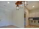 Cozy kitchenette features white cabinets and black and white tile backsplash at 70 Graystone Dr, Covington, GA 30014