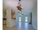 Open-concept living room with views of the kitchen and fireplace at 70 Graystone Dr, Covington, GA 30014