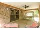Relaxing covered patio area with ceiling fan, swing, and outdoor seating at 2956 Gum Creek Rd, Oxford, GA 30054