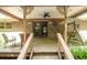Covered patio with a swing, brick accents, and outdoor furniture at 2956 Gum Creek Rd, Oxford, GA 30054