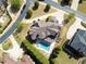 Aerial shot showcases the large home with landscaped grounds and backyard pool at 8710 Merion Dr, Duluth, GA 30097