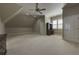 Large bonus room with neutral carpeting, great for entertainment, office, or playroom possibilities at 8710 Merion Dr, Duluth, GA 30097