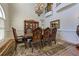 Formal dining area boasting wainscotting, chandelier, and designer rug at 8710 Merion Dr, Duluth, GA 30097