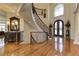 Impressive foyer featuring staircase, hardwood floors, and a front door view at 8710 Merion Dr, Duluth, GA 30097