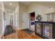 Hallway with wood floors and decorative console table at 8710 Merion Dr, Duluth, GA 30097