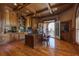 Luxurious home office with custom built-ins, hardwood floors, and a balcony view at 8710 Merion Dr, Duluth, GA 30097