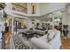Spacious living room boasts soaring ceilings, columns, hardwood floors, and a balcony at 8710 Merion Dr, Duluth, GA 30097
