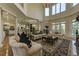 Bright living room with hardwood floors, columns, and open kitchen at 8710 Merion Dr, Duluth, GA 30097