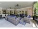 Elegant outdoor living space with brick arches, comfortable seating, and access to the pool at 8710 Merion Dr, Duluth, GA 30097