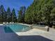 Sparkling pool and spa with stone surround, offering a relaxing backyard oasis at 8710 Merion Dr, Duluth, GA 30097