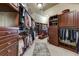 Walk-in closet with custom wood shelving at 8710 Merion Dr, Duluth, GA 30097
