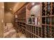 Custom wine cellar with stone floors and wood shelving for ample wine storage at 8710 Merion Dr, Duluth, GA 30097
