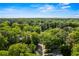 A high angle shot of a road winding through a lush, forested region showing the serene location at 1675 Avon Sw Ave, Atlanta, GA 30311