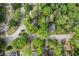 A birds eye view of a neighborhood with mature trees and winding roads, showcasing its location at 1675 Avon Sw Ave, Atlanta, GA 30311