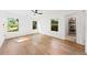 Spacious bedroom with hardwood floors, natural light, and a view to an adjoined room at 1675 Avon Sw Ave, Atlanta, GA 30311