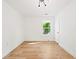 Bright and open bedroom with natural light, wood floors, and a modern light fixture at 1675 Avon Sw Ave, Atlanta, GA 30311