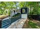 Charming front exterior with a driveway and stairs leading to the entrance at 1675 Avon Sw Ave, Atlanta, GA 30311