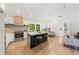 Bright and spacious kitchen featuring a large island, stainless steel appliances, and modern finishes at 1675 Avon Sw Ave, Atlanta, GA 30311