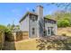 View of home's backyard featuring a nice lawn, patio and wooden fence providing privacy at 1699 Boulder Walk Se Dr, Atlanta, GA 30316