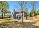 Picturesque backyard with mature trees and lawn, complemented by a toy car at 1699 Boulder Walk Se Dr, Atlanta, GA 30316