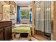 Bathroom featuring a glass-enclosed shower, bathtub and plenty of storage at 1699 Boulder Walk Se Dr, Atlanta, GA 30316