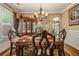 Charming dining room with hardwood floors, chandelier, and elegant furnishings at 1699 Boulder Walk Se Dr, Atlanta, GA 30316
