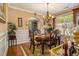 Formal dining room with wood flooring, chandelier, and an elegant dining set with seating for six at 1699 Boulder Walk Se Dr, Atlanta, GA 30316