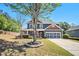 Charming two-story home featuring a welcoming front porch, attached garage and a well-maintained, landscaped front yard at 1699 Boulder Walk Se Dr, Atlanta, GA 30316