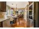 Bright kitchen area featuring a granite countertop and stainless steel appliances at 1699 Boulder Walk Se Dr, Atlanta, GA 30316