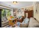Living room featuring cozy sofas, a large window, and artwork at 1699 Boulder Walk Se Dr, Atlanta, GA 30316