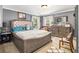 Comfortable main bedroom featuring a bed, dresser, and natural light at 1699 Boulder Walk Se Dr, Atlanta, GA 30316