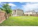 Spacious backyard featuring a wooden deck, green grass, house with siding and a wood fence at 433 Orchid Ln, Canton, GA 30114