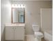 Bathroom featuring a toilet, vanity, and shower/tub combo, offering a functional and updated space at 433 Orchid Ln, Canton, GA 30114