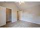 Bedroom featuring plush carpet, a ceiling fan, and a large closet, creating a comfortable living space at 433 Orchid Ln, Canton, GA 30114