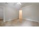 Neutral bedroom with carpet and open door to hallway, creating a bright and airy space at 433 Orchid Ln, Canton, GA 30114