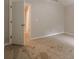 Neutral bedroom with carpet and open door to hallway, creating a bright and airy space at 433 Orchid Ln, Canton, GA 30114