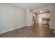 Open dining area with hardwood floors that flows into the kitchen with white cabinets at 433 Orchid Ln, Canton, GA 30114