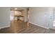 Open-concept living area with hardwood floors, dining space and kitchen at 433 Orchid Ln, Canton, GA 30114