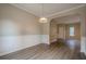 Dining room with decorative molding and an arched doorway leading to another room at 433 Orchid Ln, Canton, GA 30114