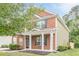 Charming two-story home with brick facade, side yard, and welcoming front porch at 433 Orchid Ln, Canton, GA 30114