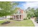 Beautiful two-story home with a well-manicured lawn, brick facade, and inviting front entrance at 433 Orchid Ln, Canton, GA 30114
