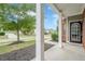 Inviting front porch view showcasing the neighborhood street and manicured landscaping at 433 Orchid Ln, Canton, GA 30114