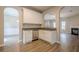 Bright kitchen features white cabinets, stainless steel appliances, and granite countertops at 433 Orchid Ln, Canton, GA 30114