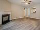 Spacious living room with hardwood floors, fireplace, and arched doorway to other rooms at 433 Orchid Ln, Canton, GA 30114