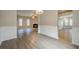 Open floor plan with dining room leading to a living room with fireplace and hardwood floors at 433 Orchid Ln, Canton, GA 30114